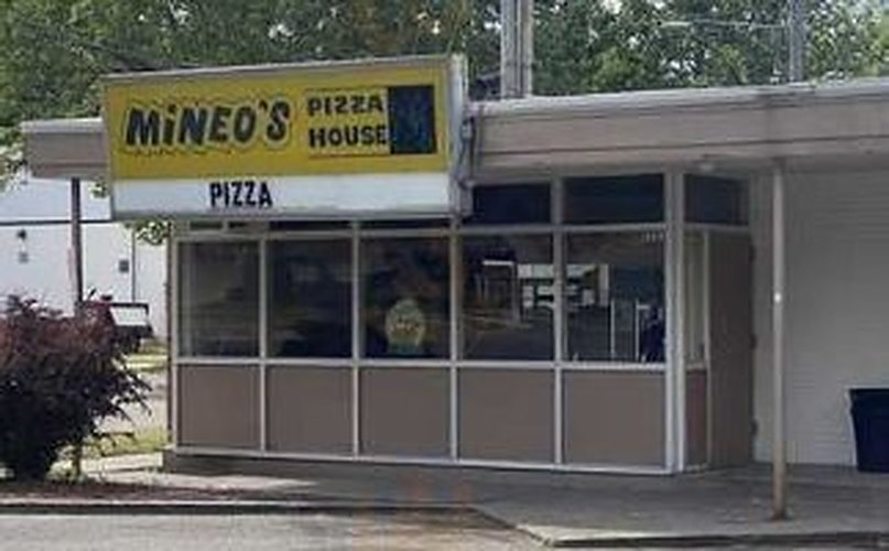 Mineo's Pizza House storefront with its yellow sign